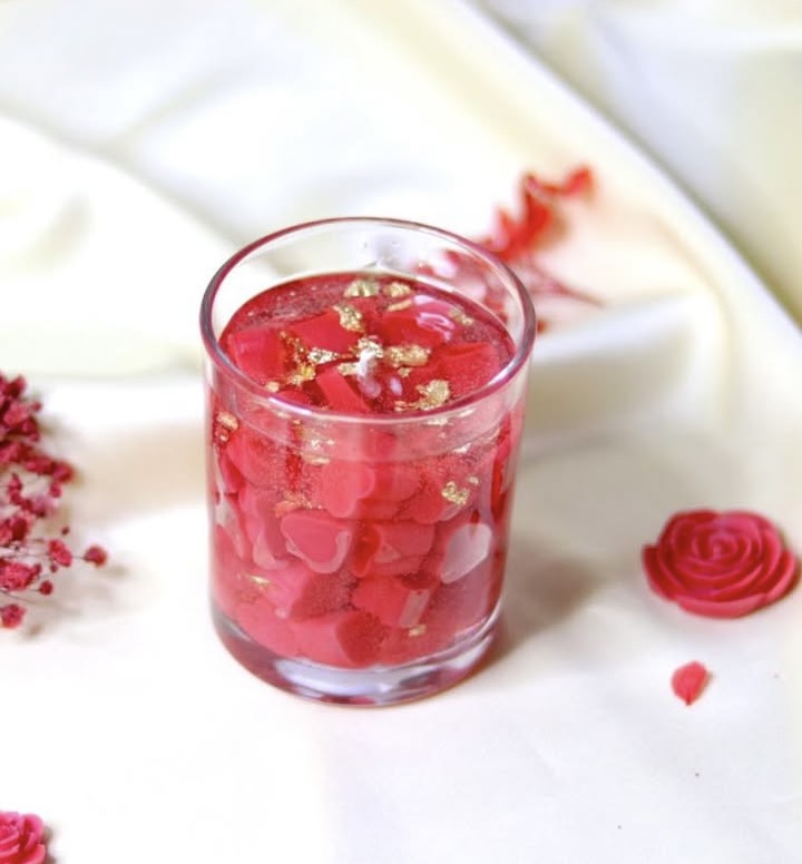 Glowing red heart jar candle